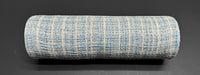 The product "10\"X10Y Lt Blue-White-Silver Metallic Tweed Mesh XB235710-04" is a cylindrical, textured object resembling a fabric roll, showcasing a woven pattern in metallic tweed with light blue and off-white threads that subtly glimmer on its dark surface.