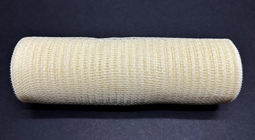 The 10X10Y Ivory Breeze Solid Mesh XB240710-18, a large beige mesh fabric roll, is placed horizontally on a black background. The tightly wound mesh features a grid-like pattern.