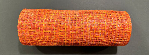 A 10X10Y Rust Orange Textured Weave Mesh (XB253510-31) sits on a dark surface, its intricate pattern and vibrant rust-orange color clearly visible.