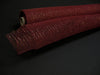 Two rolls of Burgundy/Burgundy Metallic Mesh, 10X10Y (XB90510-10), with a loosely woven texture, are displayed on a dark surface, one slightly overlapping the other.