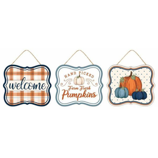 Three assorted 7L x 6H tin matte fall signs in autumn, navy, and smoke blue feature “welcome” on plaid, “Hand Picked Farm Fresh Pumpkins,” and pumpkin-themed autumn decor.