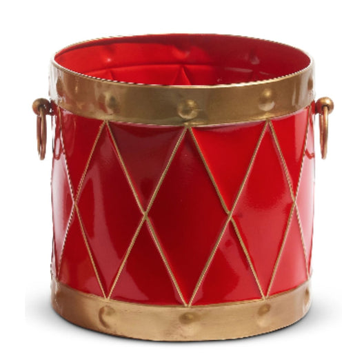 10.5" Red and Gold Drum Containers (4425918) are festive, cylindrical metal tins with gold diamond patterns, rims, and handles—resembling toy drums—ideal for Christmas Shoppe décor. 