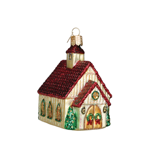 The Christmas Chapel Ornament Old World Christmas Ornament 20063 features a small church with a red roof, gold walls, green trees, and festive wreaths—perfect for holiday décor. Isolated on a white background.