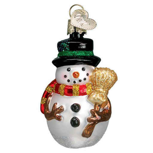 The Red Scarf Miniature Mr. Snowy Ornament by Old World Christmas features a festive snowman with a black hat, red striped scarf, golden broom, smiling face, and heart-shaped tag.