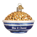 The Bowl Of Mac & Cheese Ornament by Old World Christmas (32258) captures the essence of comfort food with a shiny finish, featuring Mac & Cheese on a blue and white bowl. A metallic loop on top allows for easy hanging.