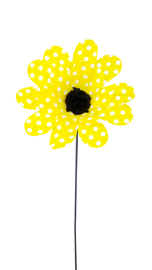 The 24 by 8 Yellow and White Polka Dot Sunflower Spray 62814YWWT features a captivating sunflower on a slender stem, boasting bright yellow and white petals adorned with polka dots and a textured black center, all against a plain black background.