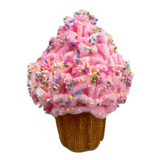 The 7 by 6 Pink Cupcake Ornament (63077PK) showcases fluffy pink frosting with colorful sprinkles on a brown cupcake base, set against a clean white background.