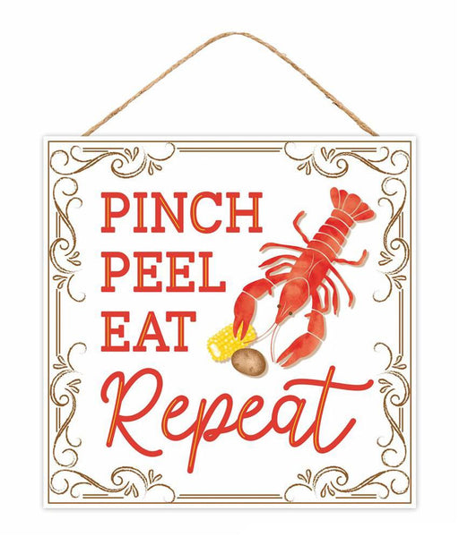 The 10 square Pinch Peel Eat Repeat Sign (AP7343) features a red lobster with corn and potato, adorned with the phrase in decorative fonts and ornate borders. Complete with a twine for hanging, it adds charm to any space.