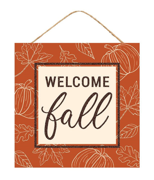 The 10 square MDF Welcome Fall Sign (Cream/Dark Orange/Brown, AP8989) features pumpkins, leaves, WELCOME fall in bold and cursive letters, and hangs by a string.