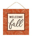 The 10 square MDF Welcome Fall Sign (Cream/Dark Orange/Brown, AP8989) features pumpkins, leaves, WELCOME fall in bold and cursive letters, and hangs by a string.