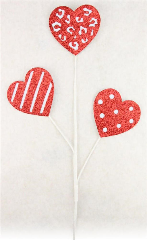The 25"H Glitter Pattern Hearts Pick X3 in Red/White (HV026024) features three uniquely designed red and white glitter hearts on white sticks, displaying captivating animal print, stripes, and polka dots against a plain white background. Ideal for adding a sparkling touch to any setting.