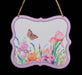 The 7L x 6H sign (MD1357) features embossed irises and butterflies over a watercolor of pink and orange flowers. It has a white, lavender, pink, and orange theme and hangs elegantly by twine.