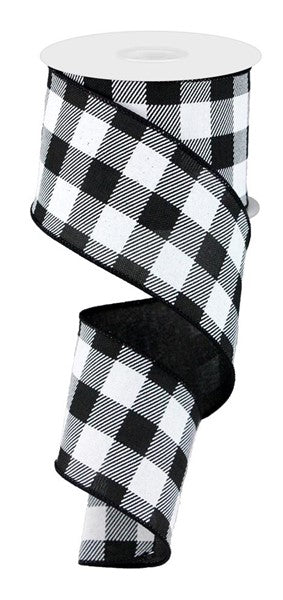 The 2.5 Black White Checked Ribbon RG0180002 features a classic buffalo plaid pattern on polyester wired ribbon, partially unrolled with a graceful curl.