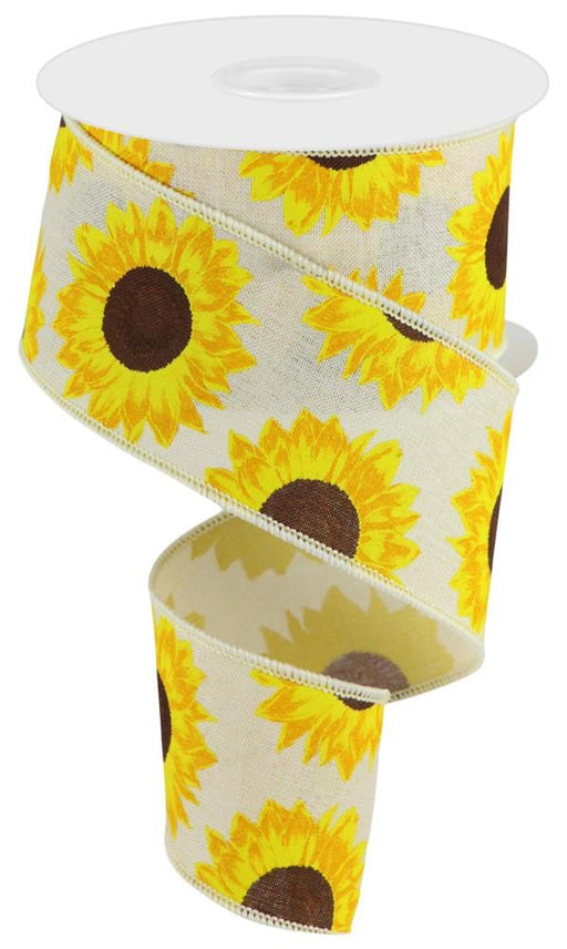 The 2.5X10Yd Sunflower On Royal Cream/Yellow/Orange/Brown RGC171164 ribbon features bright yellow sunflower patterns with brown centers on a light background and is partially unrolled, showcasing its colorful design.