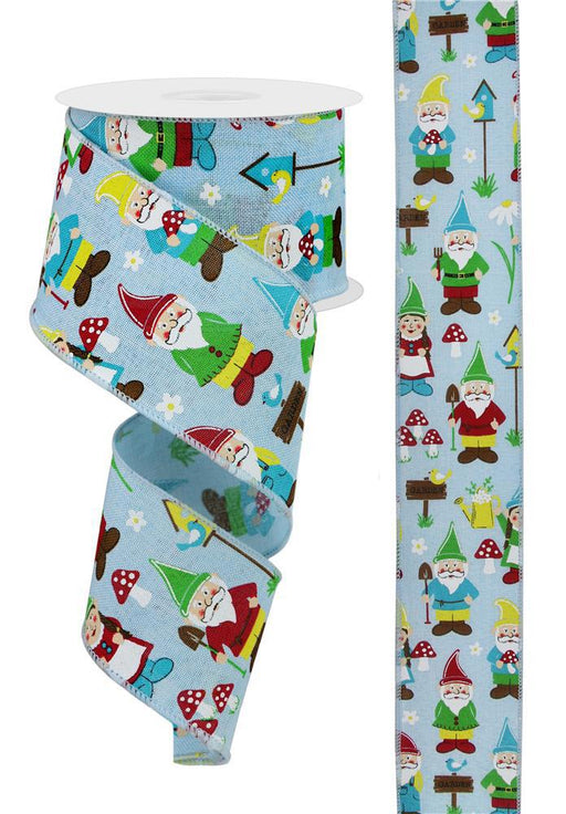 The 2.5X10Yd Garden Gnomes RGE119614 ribbon features a pale blue background with colorful gnomes, mushrooms, birdhouses, and flowers in yellow, red, and green printed in a charming repeating pattern.