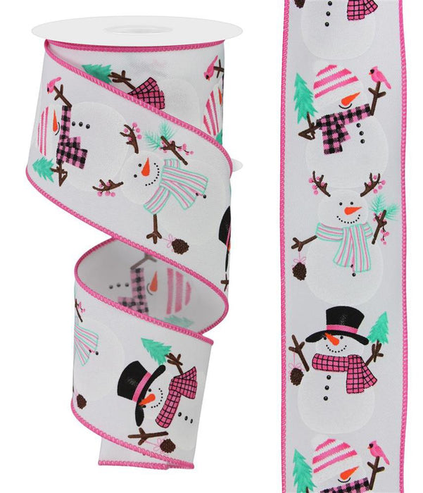 The 2.5 x 10Yd Chubby Snowman Ribbon (White/Pink/Black/Mint/Brn, RGE137027) features cheerful snowmen with hats, scarves, and mittens among trees and pinecones on pink-edged white wired fabric, shown both rolled and unrolled.