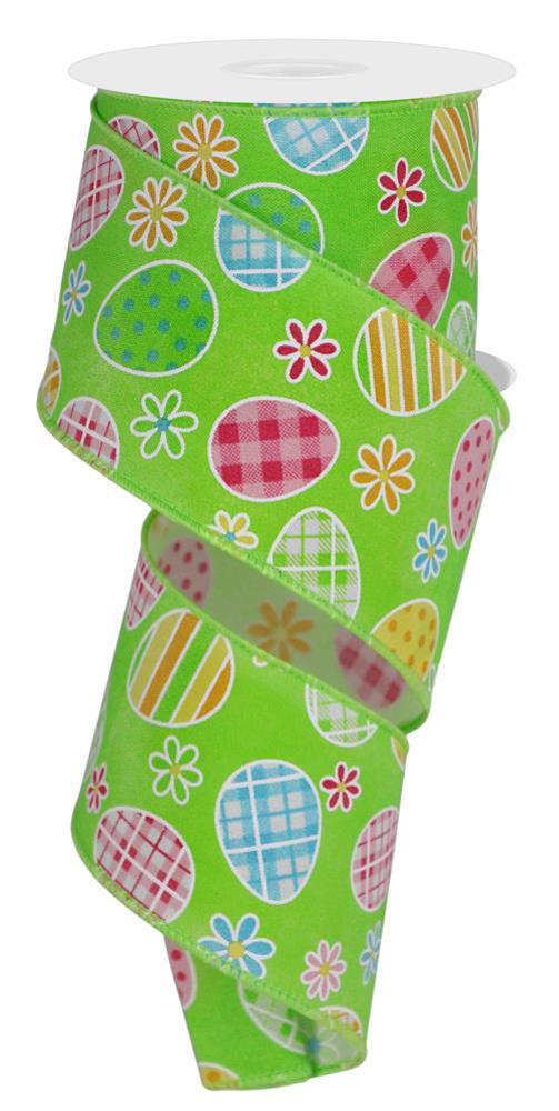 The RGE1406A4 is a 2.5 x 10-yard roll of ribbon in green, blue, lime, pink, gold, and yellow. It features check plaid patterns with Easter eggs and daisies. The design is vibrant and festive even when partially unrolled.