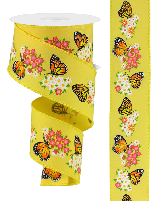The 2.5X10Yd Butterfly W/Flowers Yellow/Multi RGE174929 ribbon enchants with its yellow base, orange and black butterflies, and pink and white flowers, elegantly presented on the spool alongside a flat section.