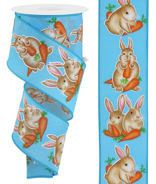 The 2.5X10Yd Bunnies W/Carrots Blue/Multi RGE175403 ribbon features brown bunnies with pink ears and orange carrots, surrounded by lush green foliage, repeating playfully along its length.