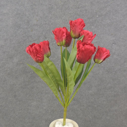 A 17 Parrot Tulip Bush with 9 red stems and green leaves, arranged in a white vase, is displayed against a plain gray background. Product: SB2376-RED.