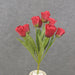 A 17 Parrot Tulip Bush with 9 red stems and green leaves, arranged in a white vase, is displayed against a plain gray background. Product: SB2376-RED.
