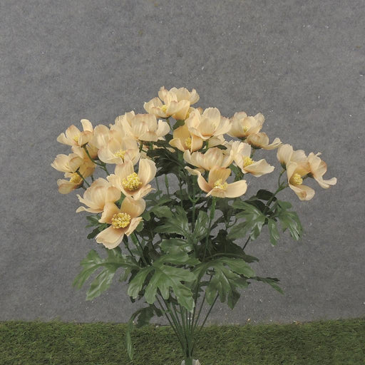 The 19 Cosmos Bush (SE2503-BEI) features 12 beige stems with light peach flowers, yellow centers, and green leaves. Set against a gray background, the dark green base mimics grass for a natural elegance.