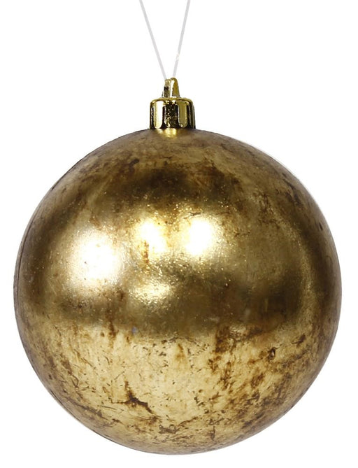 A 100mm Antique Wash Smooth Ball Ornament in 18K gold hangs against a white background. Its subtle marbling patterns add texture to the reflective finish, exuding an antique wash charm.