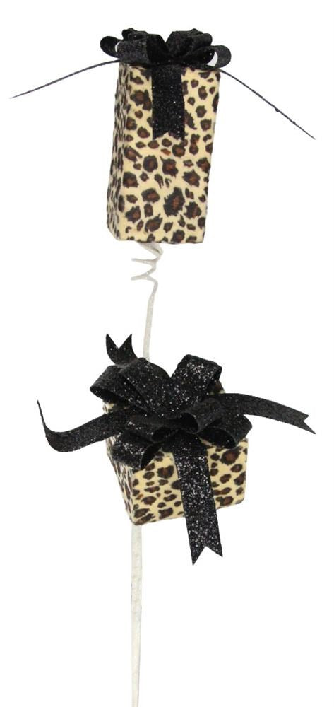 The 27H Leopard Print Package Spray (XS9976M4) features gold, black, brown, and tan boxes with large bows stacked vertically on a white spiral stick, creating a chic decorative accent.