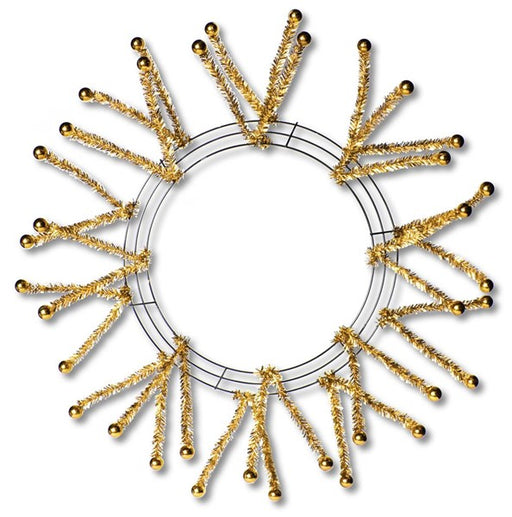 The Pencil Work Wreath with Balls 24 Metallic Gold XX751508 features shiny gold tinsel and ball accents in a starburst pattern, creating a striking decorative wreath against a white background.