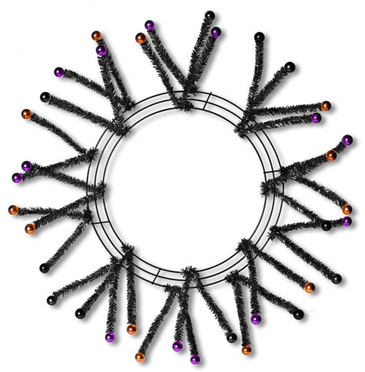 The Black Metallic Pencil Work Wreath with Purple and Copper Balls XX751571 features a circular frame with spiky black tinsel branches tipped with purple and copper balls, creating a starburst effect against a white background.
