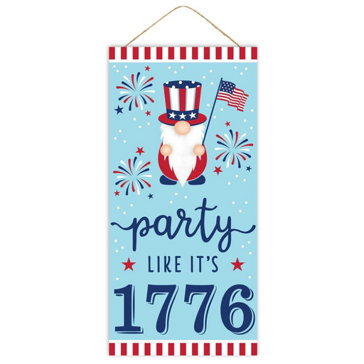 The 12.5 Party Like Its 1776 Sign AP7096 features a patriotic gnome with a stars-and-stripes hat holding an American flag, fireworks in the background, and a bold Party like its 1776 message accented by red and white stripe borders.