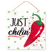 The 10 Just Chilin Chili Sign AP7103 features a smiling red chili pepper on the right, with Just Chilin in bold black letters on the left, set against a green-dotted white background. Its made of MDF paper and includes a rope for easy hanging.