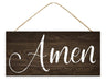 The 12.5L x 6H Amen Sign (AP7114) features Amen in elegant white script on an MDF wooden plaque, hanging by rustic rope against a dark wood background to add grace to any space.