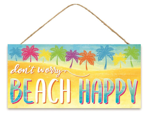 The 12.5 x 6 Dont Worry Beach Happy Sign (AP7126) is crafted from MDF, featuring a blue sky and sandy beach backdrop with palm trees in vibrant pink, purple, blue, and orange. This colorful sign hangs by a rope, adding a cheerful touch to your space.