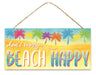 The 12.5 x 6 Dont Worry Beach Happy Sign (AP7126) is crafted from MDF, featuring a blue sky and sandy beach backdrop with palm trees in vibrant pink, purple, blue, and orange. This colorful sign hangs by a rope, adding a cheerful touch to your space.
