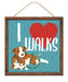 The 10 Square I Heart Dog Walks Sign (AP7128) showcases a playful brown and white dog with a green leash against a blue textured background. A red heart emphasizes the text I ❤️ WALKS, making it ideal for dog walk enthusiasts and perfect as wall decor.
