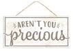 The 12.5Lx6H MDF Arent You Precious Sign (AP7163) in white/warm grey features large decorative letters and hangs by twine.