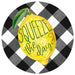 The 12Dia Squeeze The Day Lemon Sign (MD0803) features a large yellow lemon with Squeeze the Day in vibrant green letters, set against a black and white checkered background with a green leaf accent.