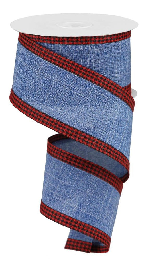 The 2.5X10Yd Royal Burlap Gingham Edge Blue Denim/Red/Black (RGA1099C6) is a partially unrolled blue fabric ribbon with red and black plaid edges and elegant gingham detailing.