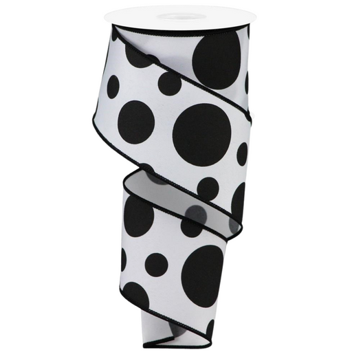 The 2.5 Giant Three Size Dot Ribbon RGA194327 features a white background with large black polka dots. Partially unwound, it forms a spiral shape highlighted by sleek black edges.