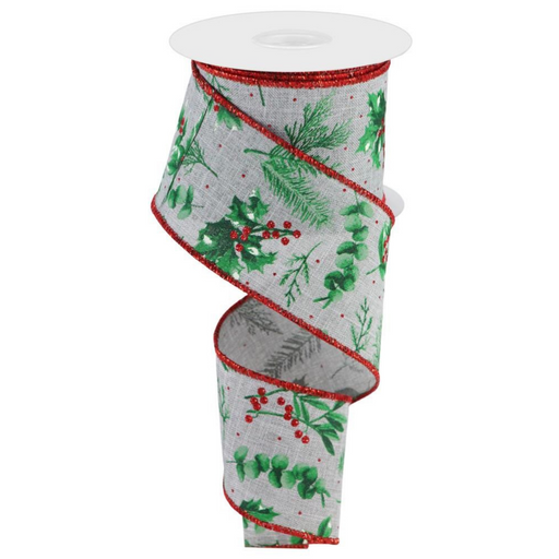 The 2.5 Light Grey Winter Foliage Ribbon RGC172810 is a polyester ribbon featuring a festive design with holly leaves, red berries, pine branches, and a red glittery edge. It is partially unwound to highlight its decorative pattern.