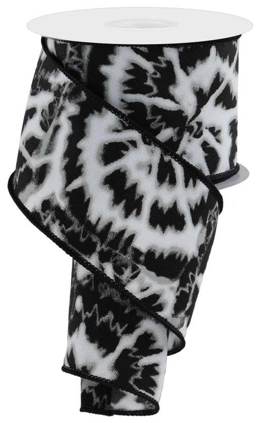 A partially unwound spool of 2.5X10Yd Soft Tie Dye On Diagonal ribbon in white, black, and grey reveals its bold spiky pattern elegantly wrapped around the central spool.