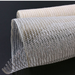 A close-up of the 10 Ivory Burlap Mesh XB97410-18 on a dark surface shows its semi-transparent, ivory-white grid pattern, featuring a slight curve as it unrolls. The texture is coarse with an underlying beige layer visible.