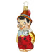 Introducing the Pinocchio Christmas Ornament Inge-Glas 1-078-15, a heirloom mouth-blown glass piece featuring the beloved long-nosed character in a red outfit, yellow shirt, blue bow tie, and feathered hat. With rosy cheeks and a friendly smile, it includes a star-shaped hook on top.