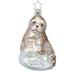 The Sea Pup Christmas Ornament Inge-Glas 1-089-15 is a mouth-blown glass ornament featuring a smiling seal on icy blue waves with a silver star hanger—a charming addition to any heirloom ornament collection.