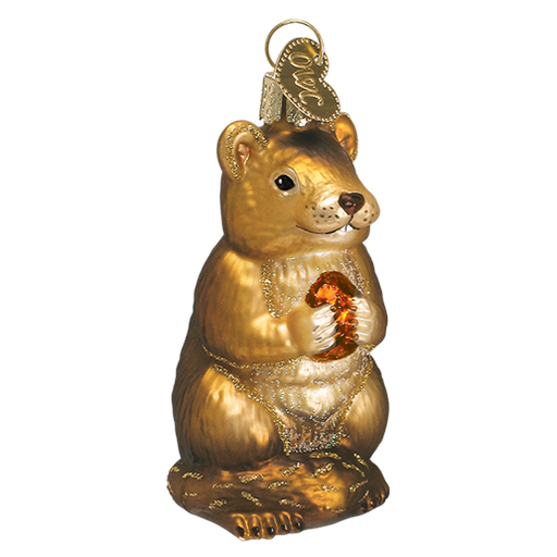 The Chipmunk Christmas 12145 Old World Christmas Ornament features a golden bear with an amber gem, reminiscent of a holiday heirloom. It stands upright with detailed features, shiny metallic finish, and has a loop for hanging as part of your festive décor.
