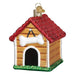 The Dog House 20113 Old World Christmas Ornament is a hand painted glass decoration with a red glittery roof, white bone above the arched doorway, and green grass at the base.