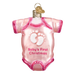 The Pink Baby Onsie Old World Christmas Ornament 32338 is hand-painted with glittery trim, white footprints, and the text Babys First Christmas. It features a gold cap on top for easy hanging.