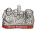 The Mount Rushmore 36183 Old World Christmas Ornament is a hand-painted glass ornament featuring the four presidents faces above a red Mount Rushmore banner.