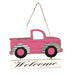 The Pink Truck Welcome Sign 62465PK, crafted from MDF with metal trim and a Welcome plaque, features black wheels and adds warmth to any space, inviting guests in style.